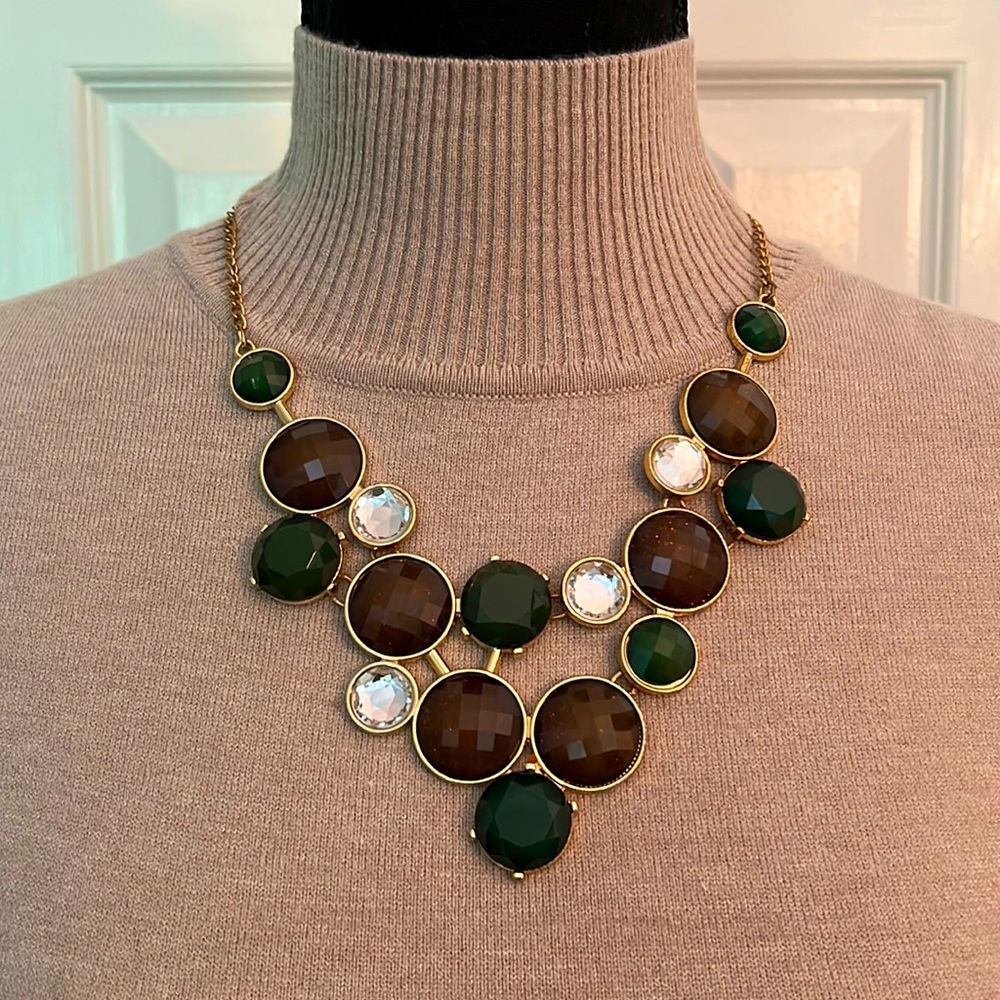 INC gold statement necklace with green, brown, and diamond-like gemstones